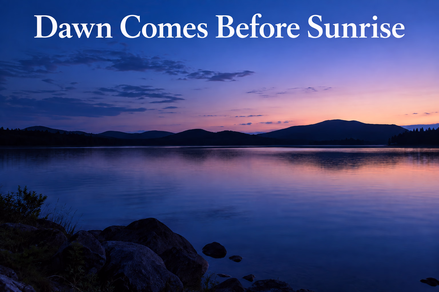 Blue-hour dawn over a quiet lake before the Sun reaches the horizon.